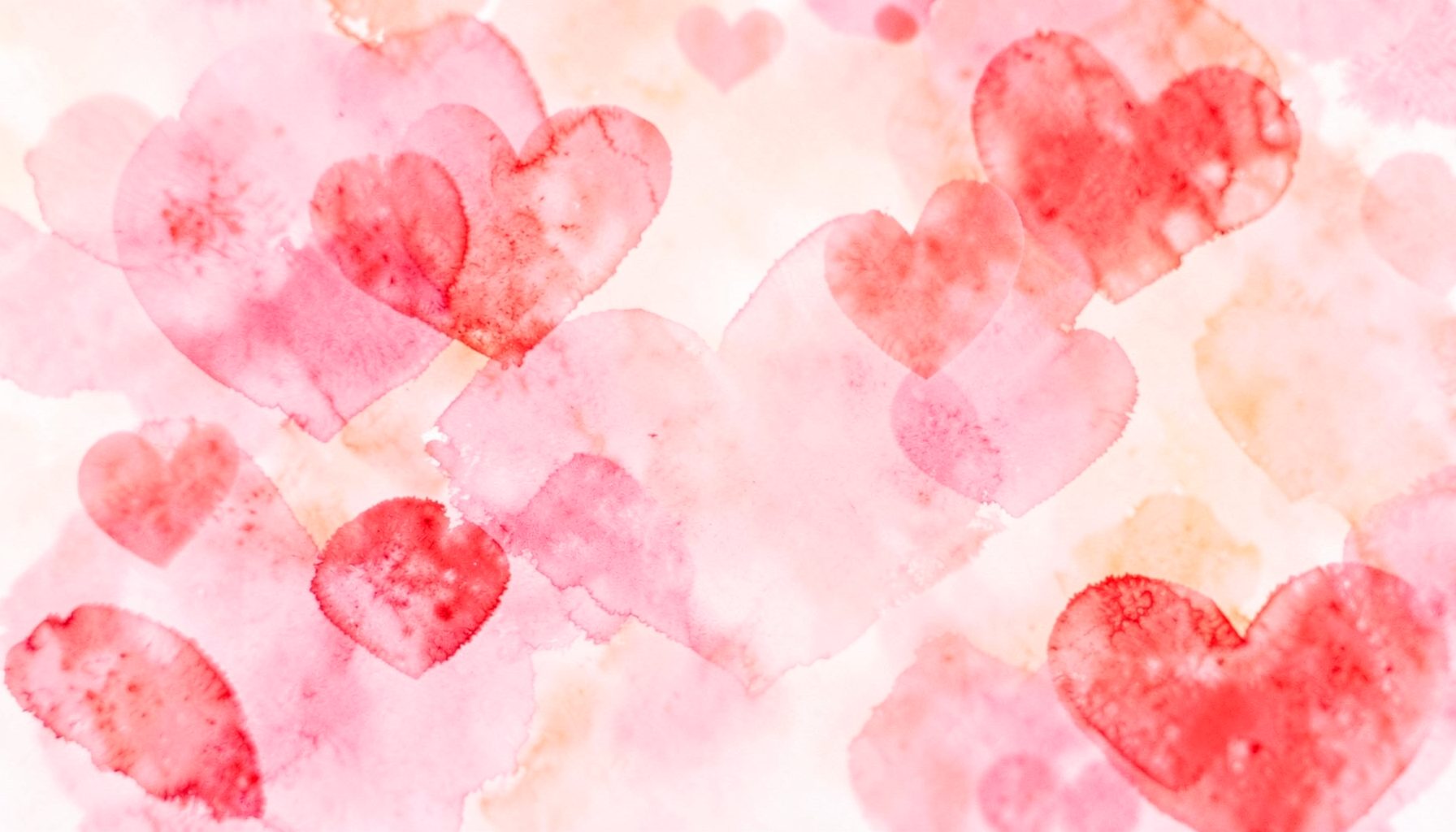 Soft pink and red watercolor hearts blending into a warm, dreamy background, romantic and tender mood.